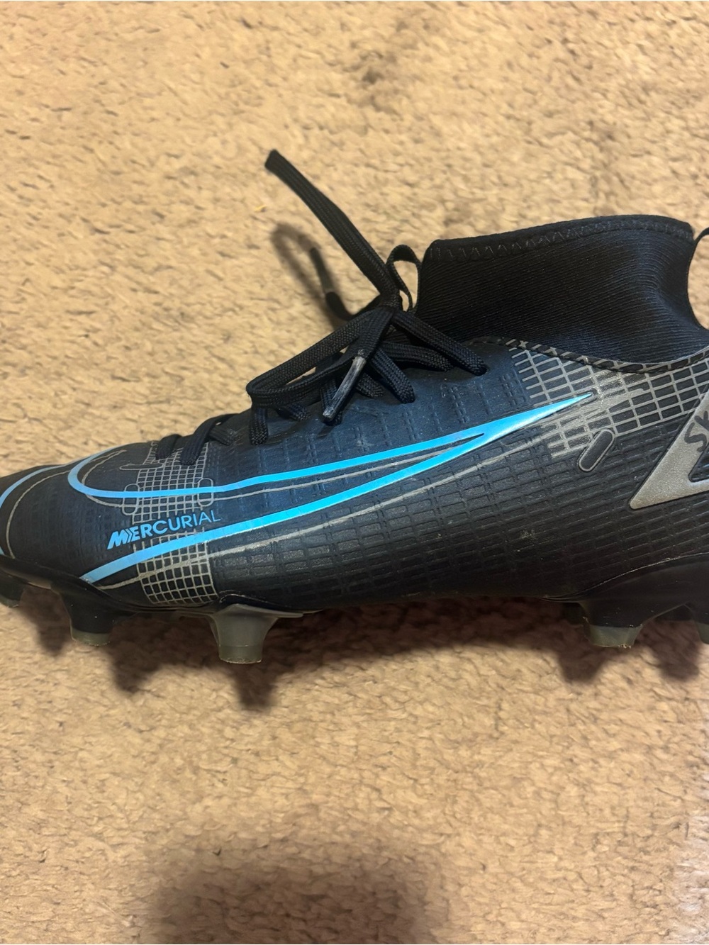 Nike Black Soccer Cleat with Blue Accents